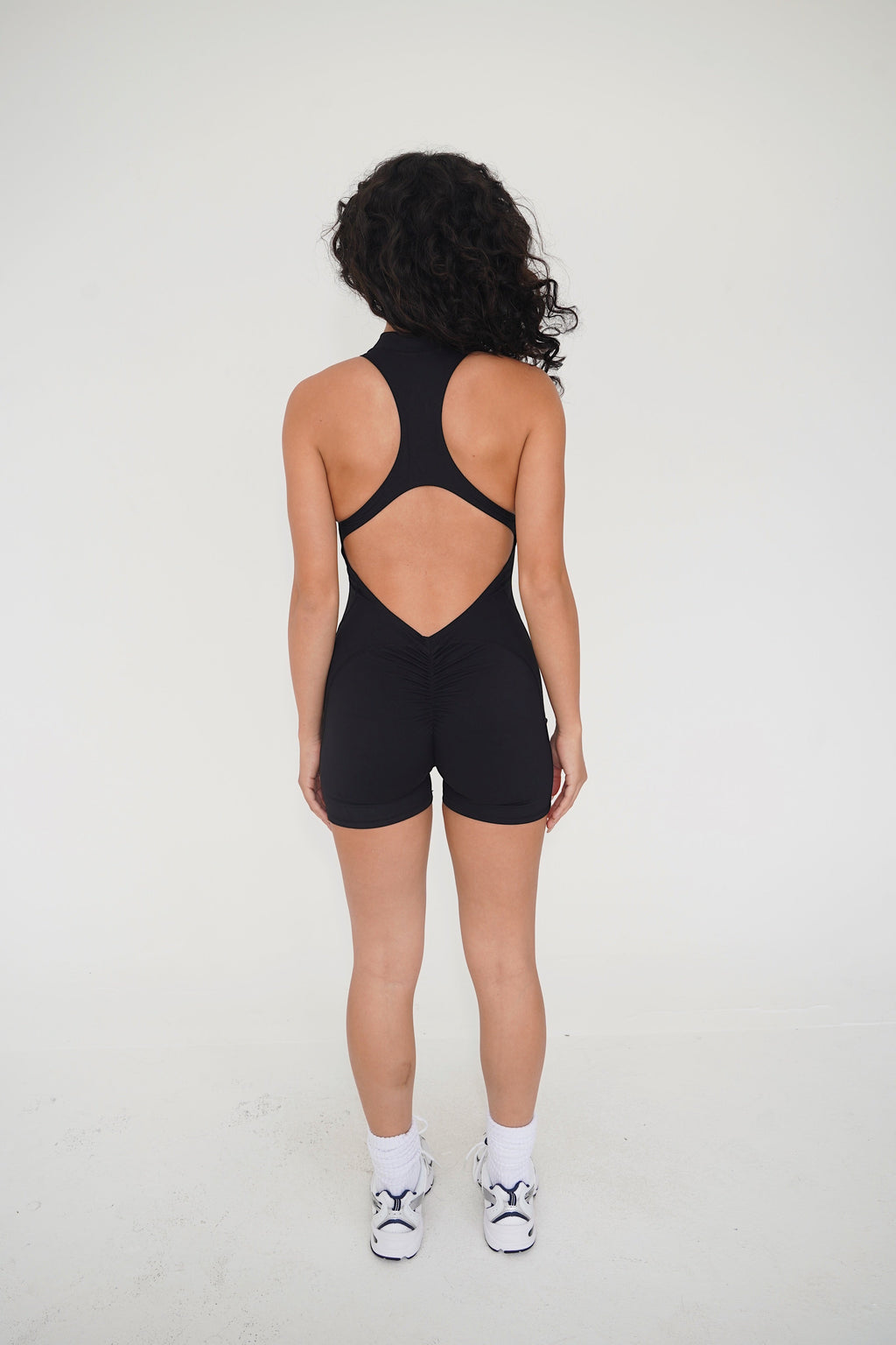 KIMITH I am Limitless Zipper Bodysuit in Black