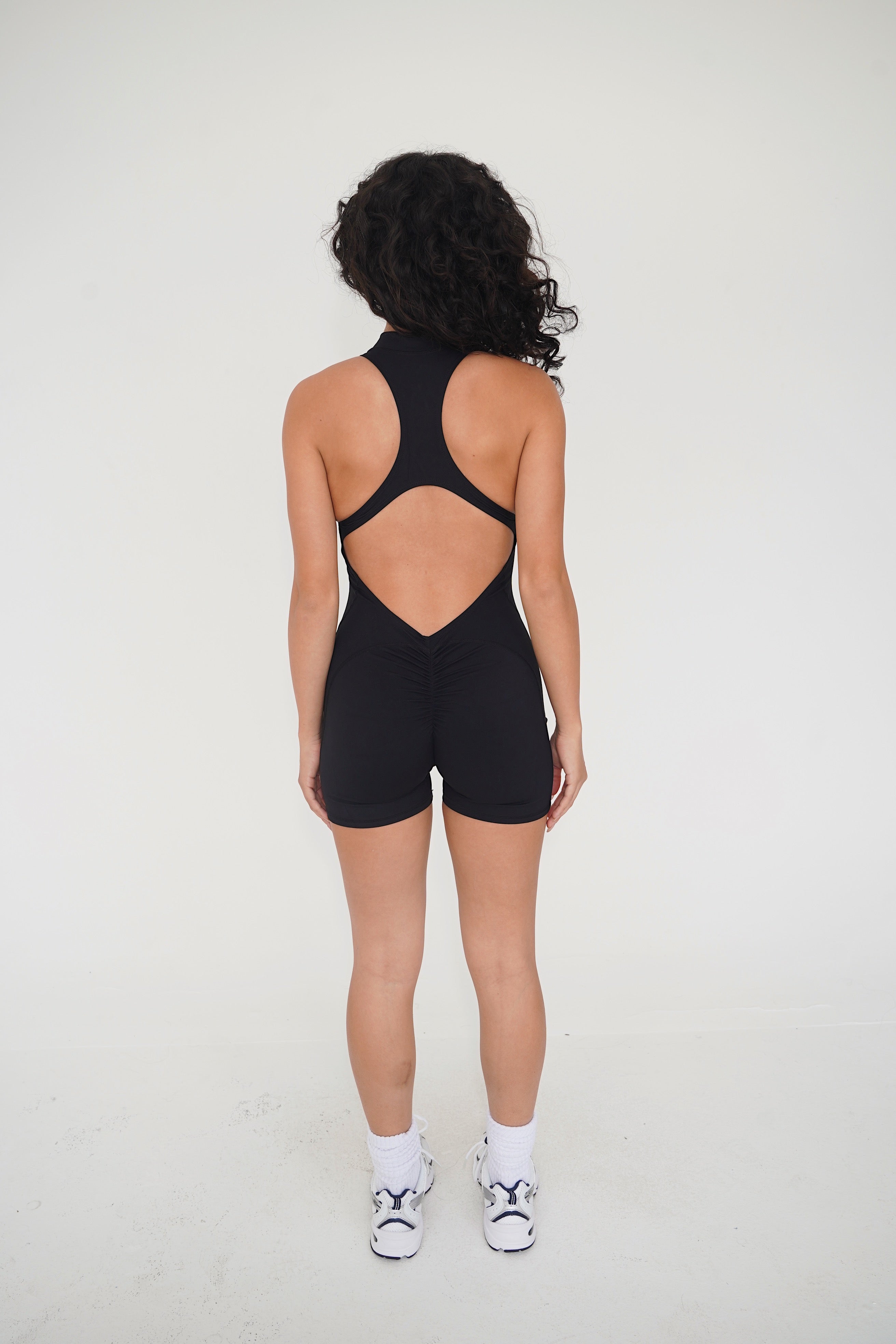 KIMITH I am Limitless Zipper Bodysuit in Black